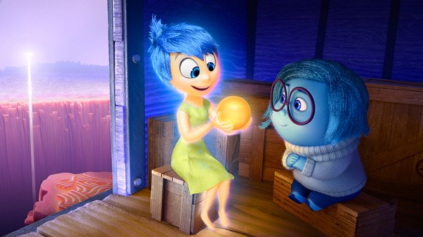 Joy (voice of Amy Poehler) and Sadness (voice of Phyllis Smith) catch a ride on the Train of Thought in Disney?Pixar's 