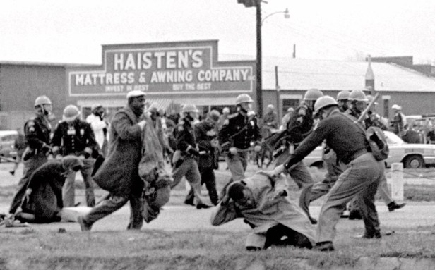 @@*@@*ADVANCE FOR WEEKEND OF AUG 2021 @@*@@*FILE @@*@@* Alabama state troopers swing nightsticks to break up the "Bloody Sunday" voting march in Selma, Ala., in this March 7, 1965, file photo. John Lewis, front right, of the Student Nonviolent Coordinating Committee is put on the ground by a trooper. The Southern Christian Leadership Conference is inextricably tied to some of the civil rights movement's greatest accomplishments, from the 1963 March on Washington to the "Bloody Sunday" march that led to the Voting Rights Act of 1965. Under the leadership of cofounder Martin Luther King Jr., the organization became a leading voice of a generation galvanized by sitins, protests and freedom rides.(AP Photo/File)